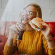 Young woman eating a burger
