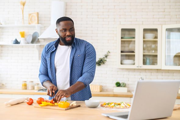 African American guy watching cooking classes